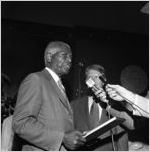 Governor Jimmy Carter with Dr. Benjamin E. Mays being interviewed by WSB, after receiving the Outstanding Older Georgian Award, Morehouse College, Atlanta, Georgia, August 6, 1971.