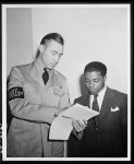 [Untitled photo shows: William Baldwin, June 1942. Baldwin was the first U.S. Navy African American recruit being assisted by a U.S. Navy Recruiting Service member, June 2, 1942]