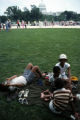 Group of people resting on green area during Bicentennial Celebration