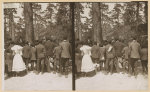 [Theodore Roosevelt speaking to a group of African American children on the edge of woods]