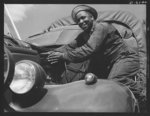 Fort Knox. Negro mechanics. A good job on the air cleaner of an army truck at Fort Knox, Kentucky. This Negro soldier, who serves as truck driver and mechanic, plays an important part in keeping army transport fleets in operation