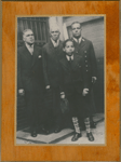 Group portrait of New York City firefighter Wesley A. Williams (right) with his father James H. Williams (left), grandfather John Wesley Williams (2nd from left) and son James H. Williams II (in front)