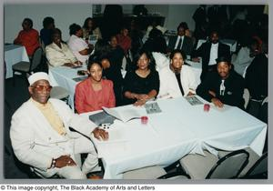 Photograph of Albert Lipscomb sitting with a group of people