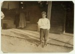 Accident to young cotton mill worker. Giles Edmund Newsom (Photo October 23rd, 1912), while working in Sanders Spinning Mill, Bessemer City, N.C., August 21st, 1912, a piece of the machine fell on to his foot mashing his toe. This caused him to fall on to a spinning machine and his hand went into unprotected gearing, crushing and tearing out two fingers. He told the Attorney he was 11 years old when it happened. His parents are now trying to make him 13 years old. The school census taken at the time of the accident makes him12 years (parents' statement) and school records say the same. His school teacher thinks that he is 12. His brother (see photo 3071) is not yet 11 years old. Both of the boys worked in the mill several months before the accident. His father, (R.L. Newsom) tried to compromise with the Company when he found the boy would receive money and not the parents. The mother tried to blame the boys for getting jobs on their own hook, but she let them work several months. The aunt said "Now he's jes got to where he could be of some help to his ma an' then this happens and he can't never work no more like he oughter."  Location: Bessemer City, North Carolina.