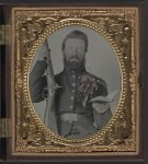 [Private David Lowry, of Company E, 25th Virginia Cavalry Regiment, Company A, 41st Virginia Infantry Regiment, and Company D, 47th Virginia Infantry Regiment, in uniform and corsage of flowers with musket and book]