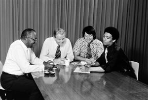 Men sitting around a table