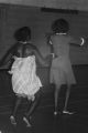 Viola Bradford learning a traditional African dance in a gymnasium, probably in Montgomery, Alabama..