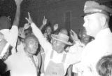 Police Chief Drue Lackey addressing a crowd during a civil rights demonstration in Montgomery, Alabama, probably ordering them to disperse.