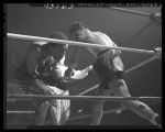 Boxer Manuel Ortiz throwing a right hand blow to Harold Dade in 1947 match, Los Angeles, Calif