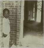 Atlanta Substandard Housing, Child Stands inside House in Poor Condition, Perry Homes, August 3, 1979