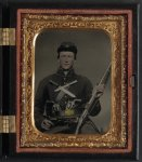 [Unidentified soldier in Union uniform with three Remington revolvers, two Bowie knives, and a Springfield rifle musket]