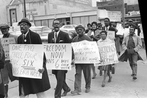 Hosea Williams leading marchers toward the Jefferson County Courthouse in downtown Birmingham, Alabama, for a voter registration rally.