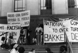 Tyree Scott speaking to people of various ethnicities in front of the United States Courthouse during the Bakke Decision Protest on the steps of the United States Courthouse in Seattle, Washington, 1977