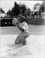 Coca-Cola Company-sponsored barbecue for African-American employees, Atlanta, Georgia, August 21, 1954. In this photo an African-American man is playing catcher in a baseball game