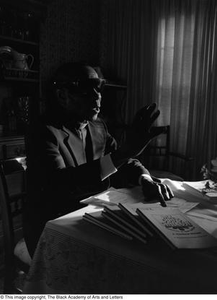 Photograph of Rev. James Garfield Owens and his book #3