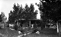 Girls cooking and serving lunch to teachers. Meeting of Beaverdam Home Makers Club in house (log cabin) of member