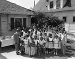 People in Front Yard with Gilbert Lindsay, Los Angeles, 1956