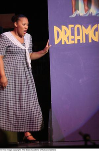 Performer Standing near Banner