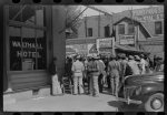 Some of the negroes watching itinerant salesman selling goods from his truck in center of town on Saturday afternoon, Belzoni, Mississippi Delta, Mississippi