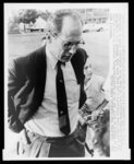 [U.S. Assistant Attorney General Byron 'Whizzer' White, half-length portrait, turned right, facing down, at press conference discussing racial troubles in Montgomery, Alabama]