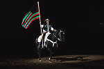 Both this flag emphasizing African Americans' history and the traditional U.S. colors were unfurled prior to the competition at the Martin Luther King, Jr., African-American Heritage Rodeo of Champions, one of the National Western Stock Show events in Denver, Colorado