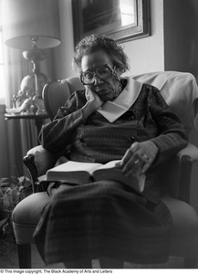 Photograph of Mable Chandler reading a book