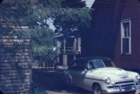 Children Outside House with Car