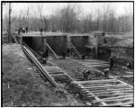 Workmen lay framework for the River des Peres sluiceway during construction of the 1904 World's Fair