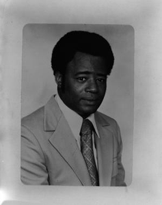 Headshot of an African American man in a suit