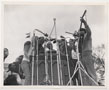 Group of demonstrators singing, Mary Travers, Peter Yarrow, Harry Belafonte, and Martin Luther King, Jr. pictured