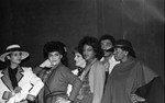 Thumbnail for Alpha Phi Alpha fashion show models standing together off stage, Los Angeles, 1985