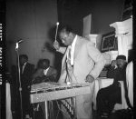 [Store Front Churches. Man playing xylophone]