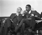 Congressman Carl Elliott seated with another man during a meeting of educators at Alabama State College in Montgomery, Alabama.