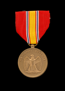 National Defense Service medal issued to First Lieutenant John E. Warren Jr.