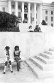 Small group watching a rally of the Ku Klux Klan from the steps of the Capitol in Montgomery, Alabama.