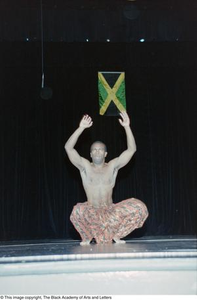 Male performer dancing at Ashe Caribbean event