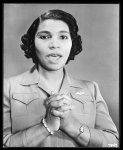 [Untitled photo shows: Marian Anderson, opera singer, singing with hands clasped and wearing a pin in the shape of the Royal Canadian Air Force pilot's wing pin badge]