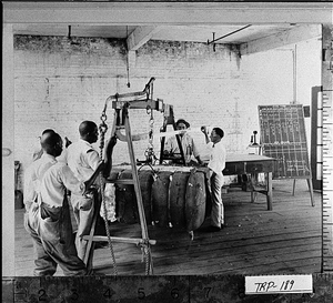 Photograph of men weighing bale of cotton at Troup Warehouse, Troup County, Georgia, ca. 1927