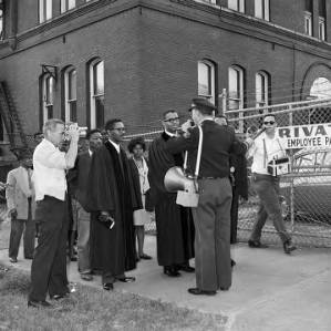 Thumbnail for Police officer blocking ministers leading marchers during a civil rights demonstration in downtown Birmingham, Alabama.