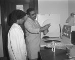 Student and professor in a science classroom at Tuskegee Institute in Tuskegee, Alabama.