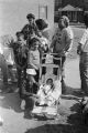 Rachel West Nelson standing with several children during the 20th anniversary commemoration of the Selma to Montgomery March in Selma, Alabama.