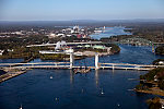 An October 2017 aerial view of the historic seaport of Portsmouth, New Hampshire, the largest city along the shortest coastline (18 miles) of any U.S. state. The focus is on the new Sarah Mildred Long Bridge, a span set to open approximately one month after the date of this photograph