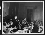 Robert W. Kenny and unidentified woman speak at a birthday party for the Independent Progressive Party of California, circa 1949, Los Angeles