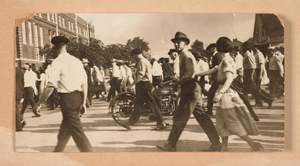 Photograph of a crowd of people walking toward a building in Tulsa