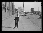 [Untitled photo, possibly realted to: Negro carrying sign in front of milk company. Chicago, Illinois]