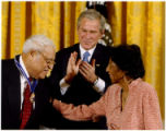 Thumbnail for Benjamin and Frances Hooks with President Bush during medal presentation