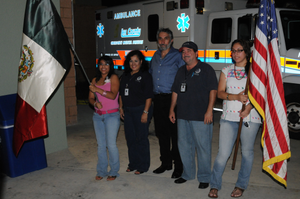 [Tropical Storm Fay] Estero, FL, September 13, 2008 -- At the Red Cross Shelter FEMA Individual Assistance(IA) Specialists Evelyn Negron and Ricardo Montes stand with the Mexican Consulate Representative Brent L. Probinsky in a flag ceremony with Mexican and American flags. The Consulate has provided a meal and appreciation ceremony for FEMA, state, other agencies and volunteers who have provided assistance to Tropical Storm Fay affected residents. George Armstrong/FEMA