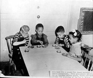 Hallie Q. Brown Nursery School children have a snack.