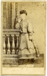 Portrait of unidentified woman leaning on balustrade