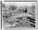 [Chinese nationalist soldiers heading to the Su Zhou front, wounded soldiers returning from battle, and other casualties lying on stretchers in the foreground]